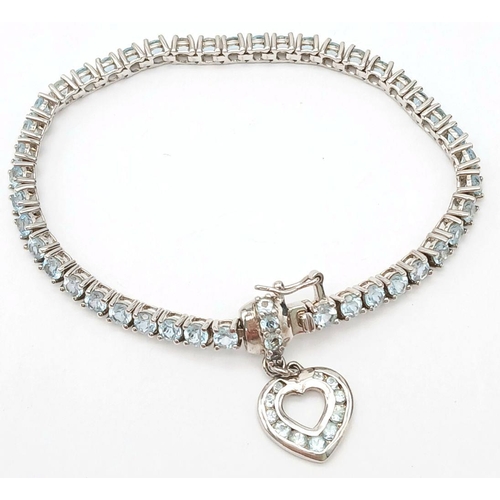 535 - Sterling Silver Aquamarine Set Heart Charm Tennis Bracelet. 19cm Length. Set with 4mm Round Cut Aqua... 