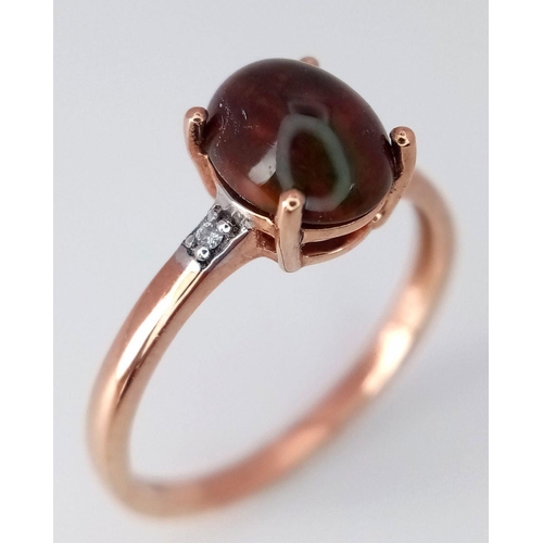 593 - A 9K Yellow Gold Diamond and Garnet Ring, 0.01ct diamond weight, 1.4ct garnet weight, 1.5g total wei... 