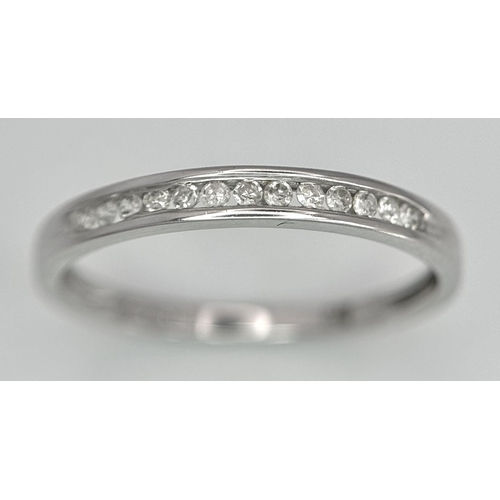 600 - A 9K White Gold Diamond Half Eternity Ring, 0.06ct diamond weight, 1.4g total weight, size N 1/2. Re... 