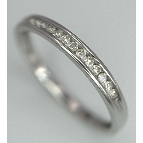 600 - A 9K White Gold Diamond Half Eternity Ring, 0.06ct diamond weight, 1.4g total weight, size N 1/2. Re... 