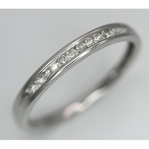 600 - A 9K White Gold Diamond Half Eternity Ring, 0.06ct diamond weight, 1.4g total weight, size N 1/2. Re... 