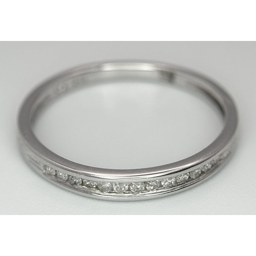 600 - A 9K White Gold Diamond Half Eternity Ring, 0.06ct diamond weight, 1.4g total weight, size N 1/2. Re... 