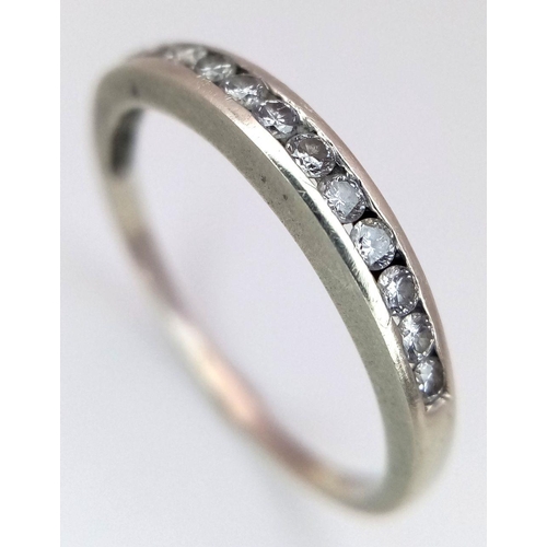 621 - A 9K WHITE GOLD DIAMOND 1/2 ET CHANNEL SET RING 0.20CT 1.48G SIZE N. Ref: A/S 1157