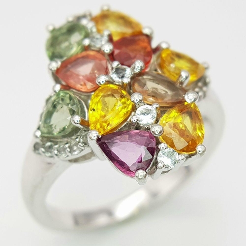 634 - A Sterling Silver Multi-Gemstone Set Ring Size Q. The Crown Measures 2cm Long and is set with Perido... 