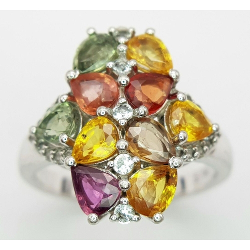 634 - A Sterling Silver Multi-Gemstone Set Ring Size Q. The Crown Measures 2cm Long and is set with Perido... 