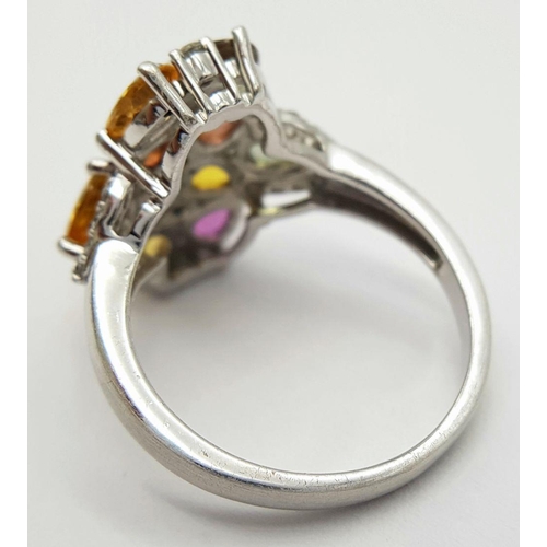 634 - A Sterling Silver Multi-Gemstone Set Ring Size Q. The Crown Measures 2cm Long and is set with Perido... 