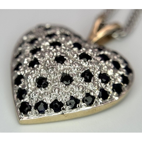 702 - A 9K Yellow Gold Sapphire Heart Pendant on a 9K White Gold Chain. Pendant 3cm. 44cm necklace length.... 