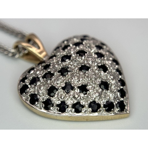 702 - A 9K Yellow Gold Sapphire Heart Pendant on a 9K White Gold Chain. Pendant 3cm. 44cm necklace length.... 