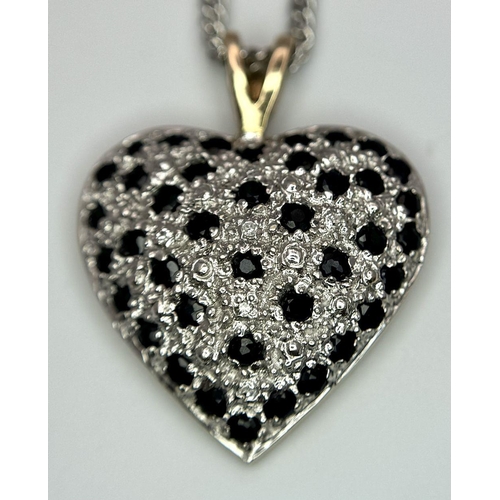 702 - A 9K Yellow Gold Sapphire Heart Pendant on a 9K White Gold Chain. Pendant 3cm. 44cm necklace length.... 