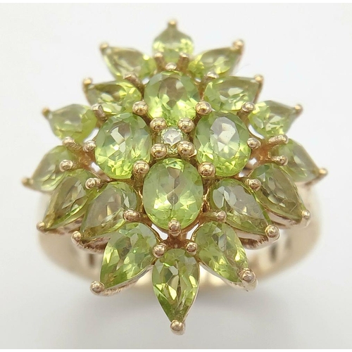 740 - A Yellow Gold Gilt Sterling Silver Peridot Set Statement Cluster Ring Size O1/2. The Crown Measures ... 