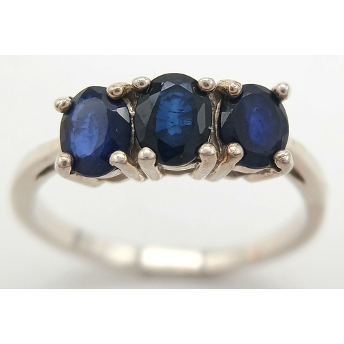 782 - A Sterling Silver Blue Sapphire Set Trilogy Ring Size R. The Ring is set with Three 5mm Oval Cut Blu... 