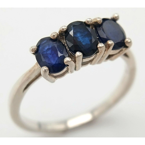 782 - A Sterling Silver Blue Sapphire Set Trilogy Ring Size R. The Ring is set with Three 5mm Oval Cut Blu... 