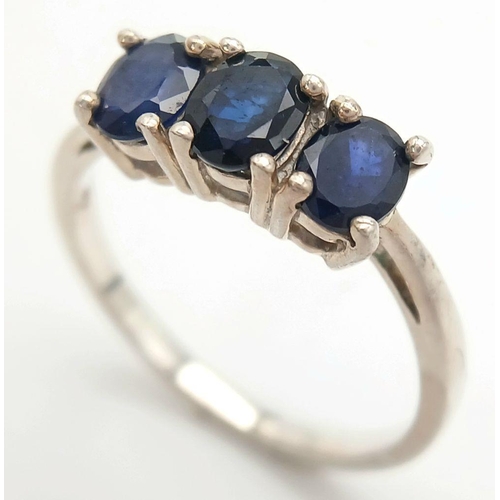 782 - A Sterling Silver Blue Sapphire Set Trilogy Ring Size R. The Ring is set with Three 5mm Oval Cut Blu... 