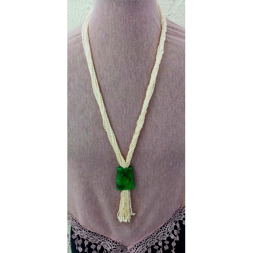 86 - An Eight Row Seed Pearl Necklace with Hanging Jade Pendant. 4cm pendant. 60cm necklace.