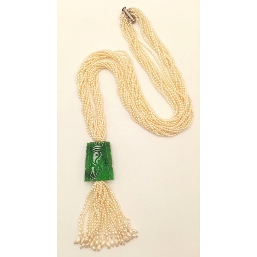 86 - An Eight Row Seed Pearl Necklace with Hanging Jade Pendant. 4cm pendant. 60cm necklace.