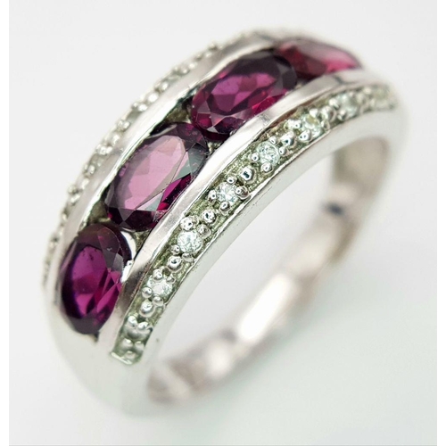 880 - A Sterling Silver Amethyst and White Topaz Set Ring Size R. The Crown Measures 9mm Wide at its wides... 