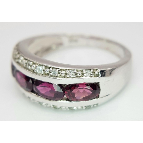 880 - A Sterling Silver Amethyst and White Topaz Set Ring Size R. The Crown Measures 9mm Wide at its wides... 