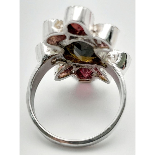 887 - A Vintage Sterling Silver Multi-Gemstone Set Ring Size Q. The ring is set with a centre 1.4cm Long O... 