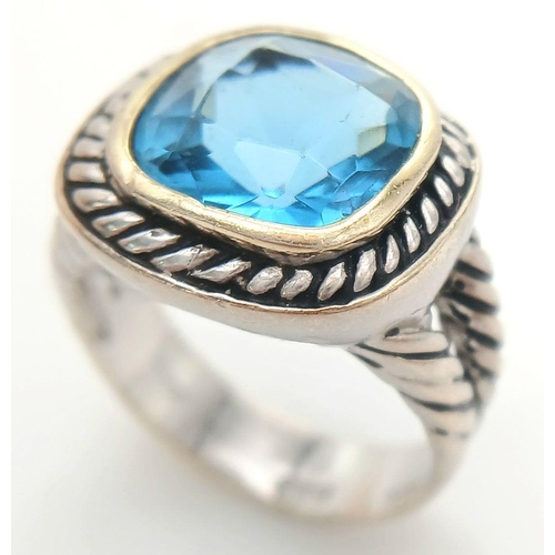 992 - A Vintage Celtic Design, Sterling Silver, Blue Topaz Set, Gold Highlight, Ring Size P. The Ring is s... 