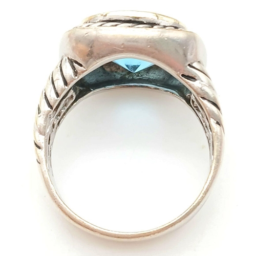 992 - A Vintage Celtic Design, Sterling Silver, Blue Topaz Set, Gold Highlight, Ring Size P. The Ring is s... 