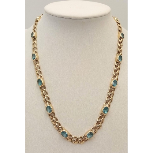 100 - A Gorgeous 9K Yellow Gold Aquamarine Necklace. Ice blue oval cuts of aquamarine between woven shaped... 