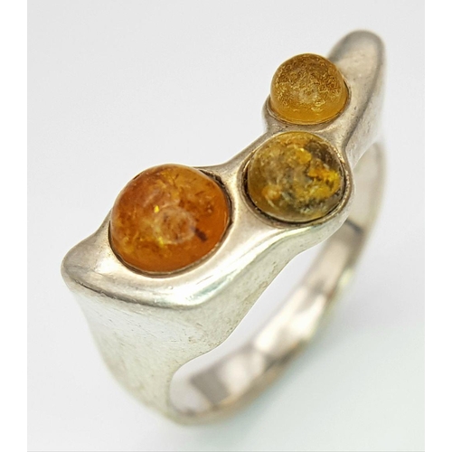 1006 - A Vintage Modernist Design Silver and Amber Set Ring Size R. The Crown Measures 2.2x1cm at its wides... 