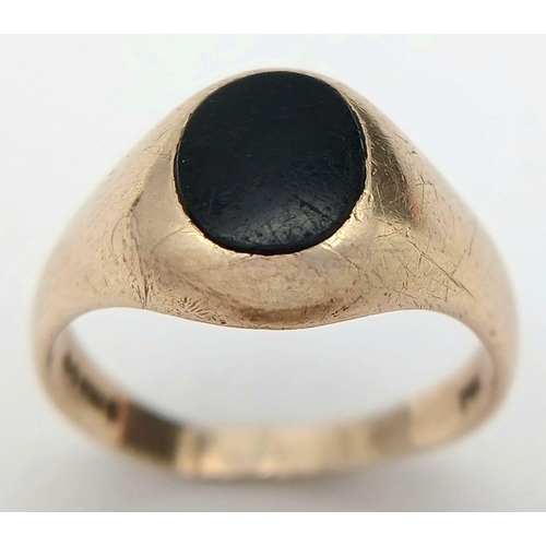 148 - A Vintage 9K Yellow Gold Black Onyx Signet Ring. Full UK hallmarks. Size T 1/2. 5.5g total weight.