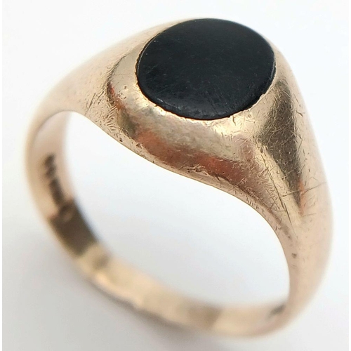 148 - A Vintage 9K Yellow Gold Black Onyx Signet Ring. Full UK hallmarks. Size T 1/2. 5.5g total weight.