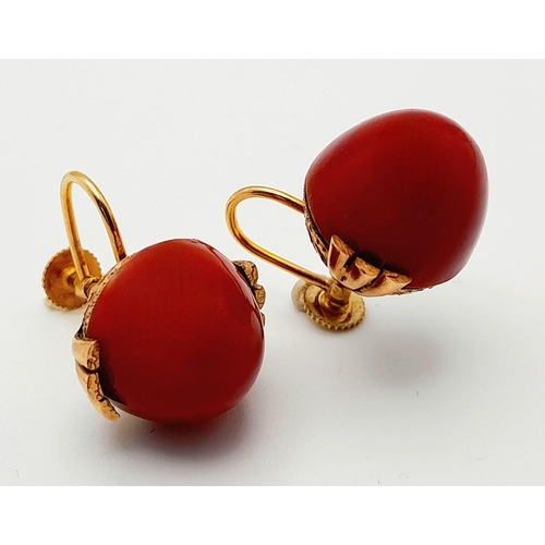 218 - A Pair of Antique 9K Gold and Red Coral Domed Earrings.
Beautifully constructed with screw clasps. 9... 