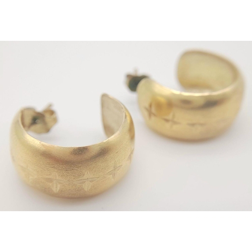 239 - A 9K Yellow Gold Pair of Wide Hoop Earrings. 10mm wide. 3.5g total weight.