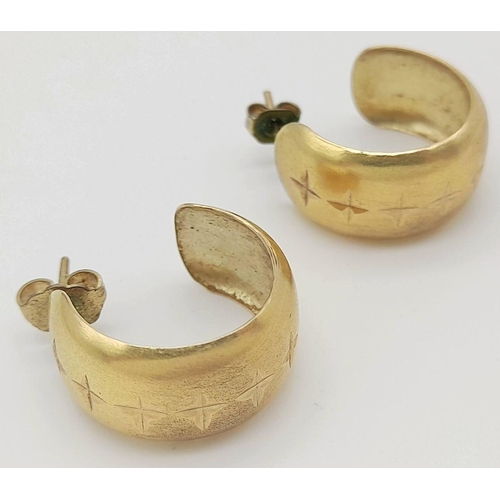 239 - A 9K Yellow Gold Pair of Wide Hoop Earrings. 10mm wide. 3.5g total weight.