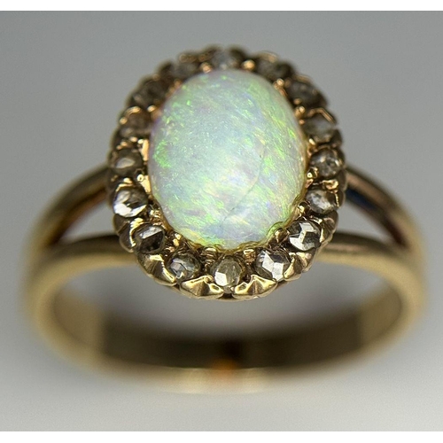 306 - A 14K Yellow Gold (tested as) Opal and Diamond Halo Ring, 0.16ct diamond weight, 10x7mm opal size, 3... 