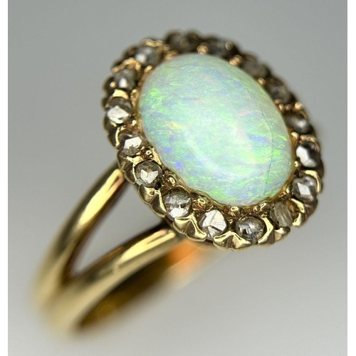 306 - A 14K Yellow Gold (tested as) Opal and Diamond Halo Ring, 0.16ct diamond weight, 10x7mm opal size, 3... 