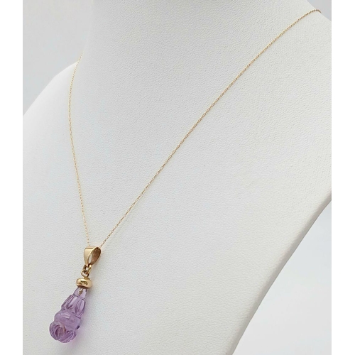 367 - A Vintage 14 Carat Gold Necklace with a Minimum 9 Carat Gold Carved Amethyst Pendant. 41cm Length, P... 