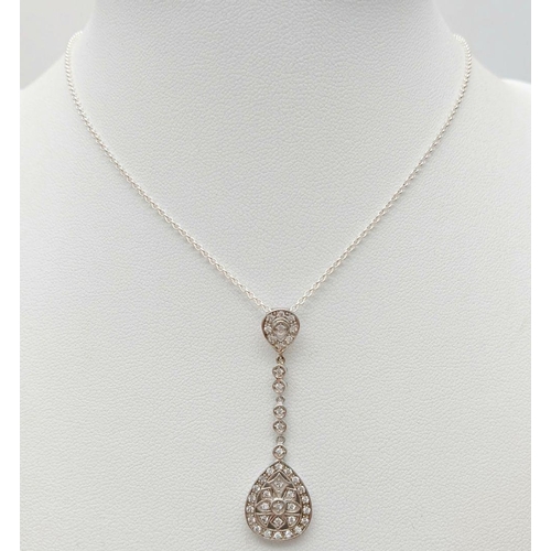 507 - A Stunning Sterling Silver and Diamond Set Pendant Necklace. 46cm Length chain. Pendant length 4.2cm... 