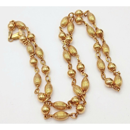 57 - A Delightful 9K Yellow Gold Coffee Bean-Esque and Bauble Link Chain. 50cm length. 17.1g weight.