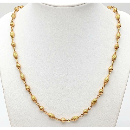 57 - A Delightful 9K Yellow Gold Coffee Bean-Esque and Bauble Link Chain. 50cm length. 17.1g weight.