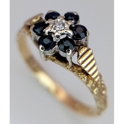 649 - A 9K YELLOW GOLD DIAMOND & SAPPHIRE SET, IN THE FLORAL DESIGN RING 2.1G SIZE N. Ref: SC 4004