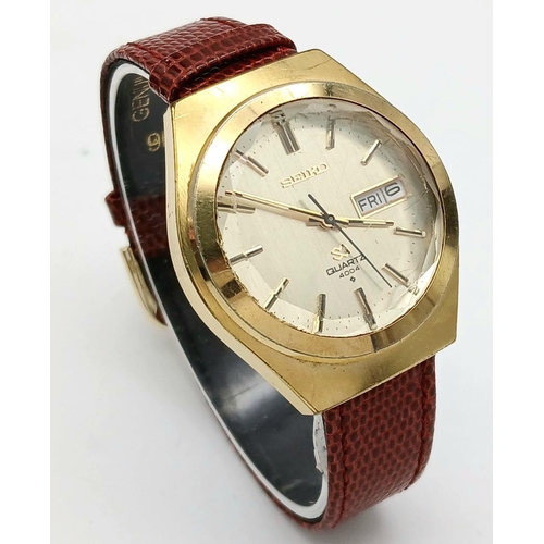 718 - A Vintage Seiko Quartz Model 4004 Day/Date Watch. 36mm Case. This Watch has the rare bevelled edge t... 