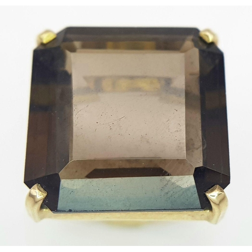 723 - A Classic 9K Yellow Gold Smoky Quartz Dress Ring. Size M. 7.3g total weight.