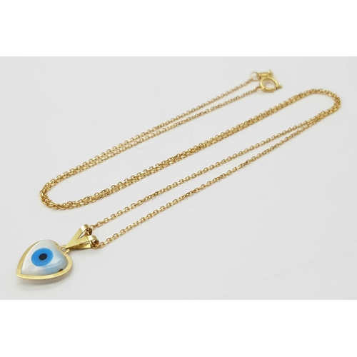 933 - An 18K Gold and Enamel Evil Eye Pendant on an 18K Gold Disappearing Necklace. 15mm pendant. 44cm nec... 