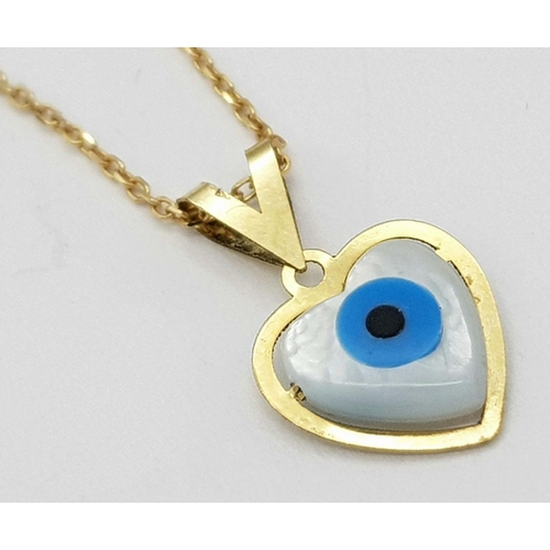 933 - An 18K Gold and Enamel Evil Eye Pendant on an 18K Gold Disappearing Necklace. 15mm pendant. 44cm nec... 