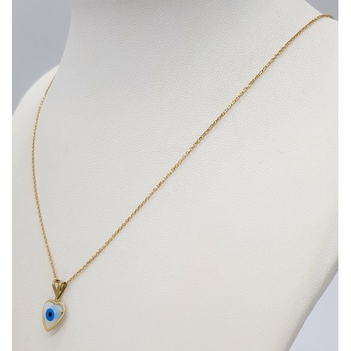 933 - An 18K Gold and Enamel Evil Eye Pendant on an 18K Gold Disappearing Necklace. 15mm pendant. 44cm nec... 