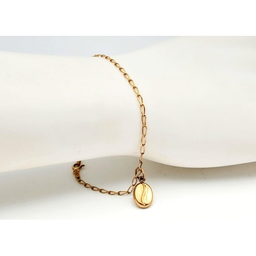 991 - A Delicate 9K Yellow Gold Bracelet with Hanging 9K Gold Coffee Pendant. 18cm length. 1.25g total len... 