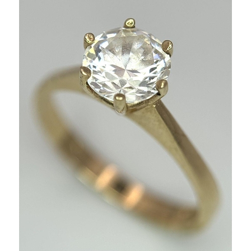 998 - A 9K Yellow Gold White Zircon Ring. Full UK hallmarks. Size O 1/2. 2.7g total weight.