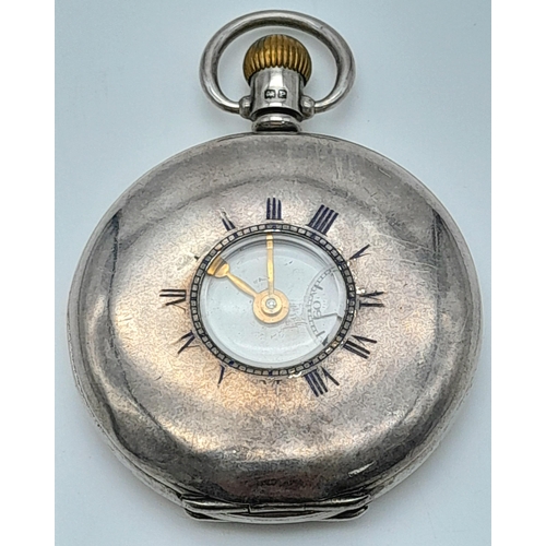 107 - An Antique Sterling Silver Omega Half-Hunter Pocket Watch. Top winder. 52mm diameter. White dial wit... 