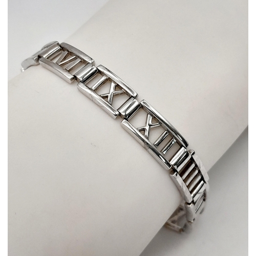 13 - A TIFFANY & CO 18K WHITE GOLD ATLAS RANGE BRACELET. TOTAL WEIGHT 24G. 19CM IN LENGTH. RECENTLY RE RH... 