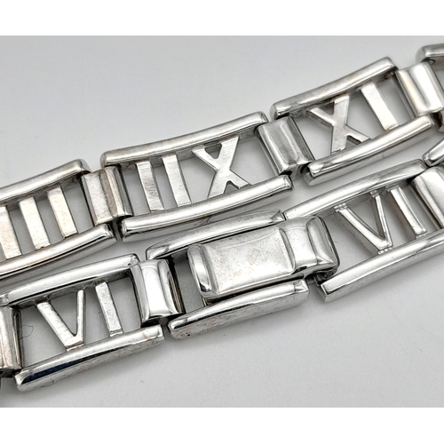 13 - A TIFFANY & CO 18K WHITE GOLD ATLAS RANGE BRACELET. TOTAL WEIGHT 24G. 19CM IN LENGTH. RECENTLY RE RH... 