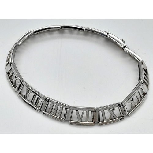 13 - A TIFFANY & CO 18K WHITE GOLD ATLAS RANGE BRACELET. TOTAL WEIGHT 24G. 19CM IN LENGTH. RECENTLY RE RH... 