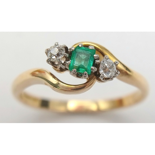 144 - A 18K YELLOW GOLD & PLATINUM DIAMOND & EMERALD 3 STONE TWIST RING. TOTAL WEIGHT 3G. SIZE N. Ref: SC ... 